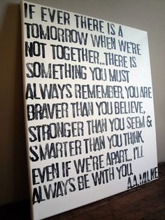 a white canvas with black writing on it that says if ever there is a tomorrow when we are not together, there is something you must always be