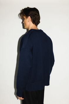 Tailored for an oversized, relaxed fit with dropped shoulders, exaggerated ribbed edges and extra long sleeves. Made with cash-wool™, a cozy 100% heavyweight wool woven to mimic the natural softness of cashmere. A reimagined wardrobe staple that combines considered proportions with luxurious craftsmanship. Oversized Aesthetic, Extra Long Sleeves, Navy Sweaters, Mens Navy, Collar And Cuff, The Natural, V Neck Sweater, Oversized Fits, Vneck Sweater