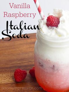 raspberry italian soda in a mason jar with whipped cream