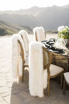 a dining table with white fur on it