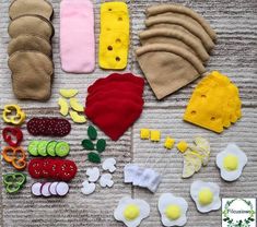 an assortment of felt food items on a table