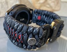 "FREE USPS PRIORITY MAIL SHIPPING FOR DOMESTIC US ORDERS (Includes U.S. Military APO/FPO Address Overseas) Thank you for visiting our shop \"Cording 2U\". A veteran owned business. Handcrafted Paracord wearables customized \"According To You\". Handcrafted with 100% Nylon Paracord \"MADE IN USA\" Our Products include: 🔹Custom handcrafted watch bands according to your wrist size, style, and color of choice. If you don't see it in our page yet, please contact us and we can discuss your options. ? Custom Handmade Black Watch Bands, Custom Black Watch Bands For Outdoor, Custom Black Outdoor Watch Bands, Customizable Black Watch Accessories For Outdoor, Custom Black Watch Accessories As Gift, Custom Black Watch Accessories For Gift, Handmade Black Watch For Everyday Use, Handmade Black Watches For Everyday Use, Custom Black Watch Accessories For Outdoor