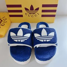 Elevate Your Style Game With These Stunning Authentic Gucci X Adidas Gg Platform Slides/Sandals In Blue. These Designer Slides Are Perfect For Casual Occasions And Are Guaranteed To Make A Statement. The Slip-On Closure Makes It Easy To Wear Them, And The Adjustable Feature Ensures A Comfortable Fit. The Upper Material Is Made Of High-Quality Terry-Cloth Like Material. The Non-Slip Feature Adds An Extra Layer Of Safety And Ensures That You Can Wear Them Confidently. Designer Slides With Rubber Sole And Round Toe, Blue Gucci Sneakers With Branded Insole, Gucci Blue Round Toe Sneakers, Blue Gucci Sneakers With Round Toe, Designer Slides With Round Toe And Rubber Sole, Gucci Blue Leather Sandals, Blue Leather Gucci Sandals, Designer Gucci Slides With Rubber Sole, Blue Gucci Leather Sandals