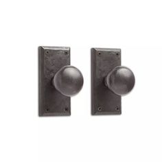 two metal door knobs on a white background