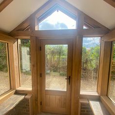 a room with three windows and benches in it