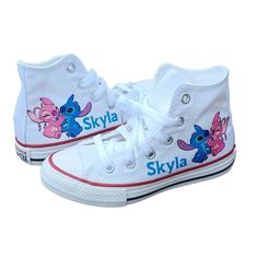 a pair of white sneakers with the name skyla printed on each shoe and blue stitching