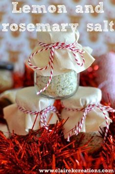 lemon and rosemary salt recipe in a jar on top of red tinsel with candy canes