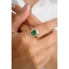 This 18k gold statement ring showcases an octagon-cut center emerald, surrounded by a dazzling baguette-cut diamond halo. The vibrant green emerald contrasts beautifully with the sparkling diamonds, creating a captivating and luxurious piece. Perfect for special occasions, this ring exudes sophistication and timeless elegance, making it a must-have addition to any jewelry collection. Emerald enhances intellectual capacity of the person.  Designed with octagon cut emerald set with halo diamonds that makes it a perfect fit to wear it on your wedding or style it with any of your basic outfit to give it a glam. This is a perfect Emerald Wedding Ring. This is a perfect May Birthstone Jewelry also perfect Grandma Gift, Valentine Gift, Gift For Mom, Wedding Gift, Engagement Gift, Mother Daughter Emerald Engagement Ring Art Deco, Gold Bezel Engagement Ring, Baguette Halo, Emerald Band Ring, Emerald Set, Mom Wedding Gift, Emerald Wedding Rings, Bezel Engagement Ring, Statement Rings Diamond