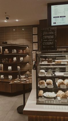 a display case in a bakery filled with pastries