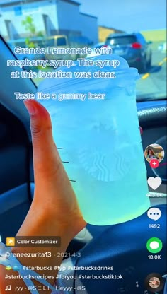 someone holding up a plastic cup in their hand with the caption's on it