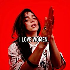 a woman holding her hands up with the words i love women in front of her