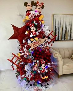 a christmas tree decorated with mickey mouse decorations