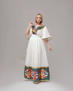 This ሀበሻ Kemis is a true masterpiece of Ethiopian fashion that features a unique and intricate Tilf design. The Tilf design is a beautiful and traditional Ethiopian pattern that adds a touch of uniqueness and sophistication to the overall design. The dress is elegant and sophisticated, with a flattering and comfortable fit that accentuates the beauty of the wearer. The Tilf design on the dress is intricate and beautiful, a testament to the skill and craftsmanship of Ethiopian artisans. The dress Ethiopian Pattern, Ethiopian Coffee Ceremony, Ethiopian Fashion, Eritrean Dress, Habesha Dress, Ethiopian Traditional Dress, Ethiopian Dress, Habesha Kemis, Look Your Best