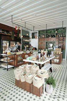 a kitchen filled with lots of pots and pans on top of a table next to a counter