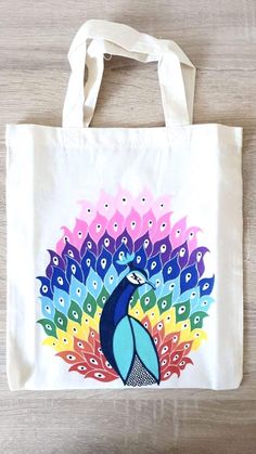 a tote bag with a colorful peacock on it