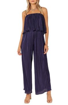 Retro vibes are alive in this '70s-inspired jumpsuit featuring a flouncy bodice, roomy legs and allover pleats. Pull-on style Adjustable straps Square neck Unlined 100% polyester Hand wash, dry flat Imported Sleeveless Pleated Jumpsuits And Rompers For Spring, Chic Sleeveless Pleated Jumpsuits And Rompers, Chic Pleated Jumpsuits And Rompers For Spring, Casual Strapless Jumpsuit For Spring Evenings, Casual Strapless Jumpsuit For Evening In Spring, Coverall Jumpsuit, 70s Inspired, Retro Vibe, Square Neck