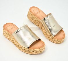 This fashionable flatform sandal pairs sleek leather with boho-chic raffia, creating a cool juxtaposition that's just as at home at the beach resort as it is in the city center. From Dolce Vita. Chic Slip-on Wedge Sandals With Woven Sole, Chic Straw Mules For Spring, Chic Straw Platform Sandals, Chic Wedge Sandals For Summer Beach, Chic Straw Sandals For Summer Outings, Chic Summer Wedge Sandals For Beach, Leather Wedge Sandals For Spring Beach Occasion, Chic Summer Beach Wedge Sandals, Chic Natural Sandals For Spring