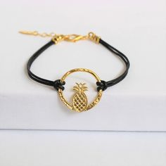 Pineapple on individually hammered circle. Gold plated on US made leather. Adjustable chain up to 8". Adjustable Hammered Everyday Jewelry, Everyday Adjustable Hammered Jewelry, Adjustable Hammered Everyday Bracelets, Adjustable Gold Leather Bracelet, Adjustable Gold Circle Bracelets, Trendy Adjustable Circle Jewelry, Adjustable Circular Gold Bracelet, Adjustable Circular Everyday Jewelry, Handmade Metal Leather Bracelet For Everyday Wear