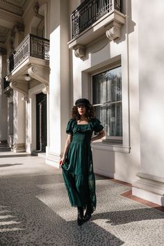 The Gracie Dress in Emerald Chiffon is a timeless classic. It features a smocked bodice and back hidden zipper for an ultra flattering and comfortable fit. Velvet trim adds a touch of luxury, while the ruffle neckline make it truly stand out. Perfect for any occasion, this holiday number is sure to be a hit. Available in sizes XXS, XS, S, M, L, XL, XXL, 1X, 2X, 3X, 4X, + 5X & matching mini and baby!! maxi dress, chiffon, chiffon dress, green dress, plus size fashion, emerald dress, emerald Elegant Fitted Maxi Smocked Dress, Elegant Fitted Smocked Maxi Dress, Elegant Fitted Smocked Dress For Garden Party, Chic Smocked Dress With Empire Waist, Green Dress Plus Size, Emerald Dress, Emerald Dresses, Collared Greens, Chiffon Overlay