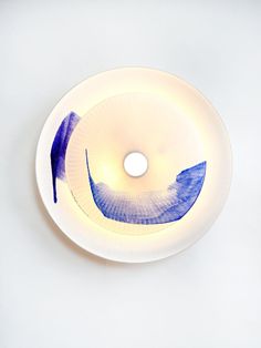 a white plate with blue designs on it