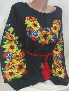 Ukrainian Embroidered Blouse for women (vyshyvanka) with traditional embroidery sunflowers. Very beautiful black embroidered blouse with long sleeves for women.  Material сotton.  Beautiful and original gifts. Range of sizes - from XS-XXL We have blouses of large and small size as well. Write us the size of the chest, waist and hips, and we will answer what size suits you the most. When ordering please tell me the volume of the chest and thighs. We will choose the right size for you! CHARACTERIS Traditional Black Shirt With Floral Embroidery, Traditional Black Embroidered Top, Black Cotton Folk Embroidered Top, Folk Style Blouse With Embroidered V-neck, Black Embroidered Blouse, Ukrainian Shirt, Original Gifts, Soviet Union, Embroidered Blouse