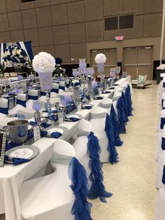 the tables are decorated with blue and white decorations