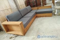 a couch sitting on top of a wooden bench