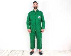 "Worker Men L Jumpsuit Boilersuit Coverall EU 52 Workwear Chore Utility Green VTG Size: Tagged as size 52, approx Men's L, please check the measurements! Condition: Good used condition. Colour: Green (Due to the quality differentiation between different monitors, the picture may not reflect the actual color of the item) Material: 65% Polyester, 35% Cotton. Weight: 705 g. Model in pictures usually wears size Large and is 6'1\" ft (185 cm) tall. Measurements: Chest (from armpit to armpit) 23 1/5\" Green Long Sleeve Cotton Jumpsuits And Rompers, Green Cotton Long Sleeve Jumpsuits And Rompers, Green Long Sleeve Cotton Jumpsuit, Green Cotton Long Sleeve Jumpsuit, Green Utility Overalls For Workwear, Fitted Utility Overalls, Green Long Sleeve Overalls For Workwear, Fitted Green Overalls For Workwear, Fitted Green Overalls