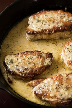 some meat is being cooked in a skillet