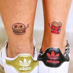 two people with tattoos on their legs and one has a hamburger and fries tattoo on their feet