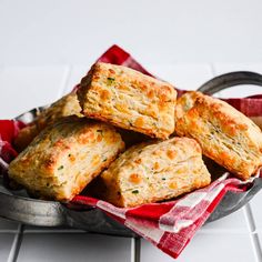 some biscuits are sitting in a metal bowl