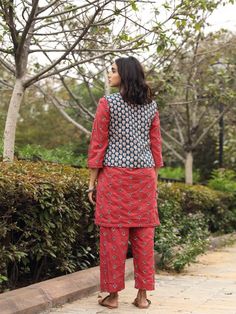 Perfectly co-ordinated set, Hunar is a 3 piece set. Top , that ends right above the knee and ankle length pants, set is perfectly finished with completely contrast jacket. Wear it at home or outside to experience utmost comfort. Color: Red Fabric: Cotton Note: Length - Kurta 36 inches Pants 38 inches Available in other colors The product will be delivered within 2-4 weeks of order placed Wash Care - Dry clean only Size Chart- SIZE BUST WAIST HIP US&CAN UK&AUS XXS 32" 30" 32" 4 8 XS 34" 32" 34" 6 Casual Fitted Sets With Straight Pants, Cotton Workwear Sets, Casual Festive Loungewear Set, Red Cotton Matching Set, Fitted Cotton Sets With Straight Pants, Winter Matching Cotton Set, Cotton Pant Set For Workwear, Festive Cotton Pant Set For Workwear, Fitted Red Cotton Set