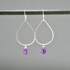 "These teardrop shaped hoops are completely made by hand from sterling silver metal. Choose from rich purple amethyst or bright teal chalcedony. The metal is hammered for texture and has a shiny finish that shimmers in the light. They are very light wight and comfortable to wear everyday. Measures about 1 3/4\" long." Handmade Amethyst Teardrop Earrings, Purple Sterling Silver Teardrop Earrings, Purple Teardrop Wire-wrapped Earrings, Nickel-free Purple Teardrop Earrings, Mod Earrings, Nickel-free Amethyst Dangle Earrings, Aqua Chalcedony, Metal Necklaces, Star Earrings