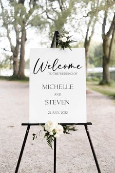 a welcome sign with flowers on it