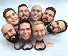 a group of men's heads with scissors in front of them