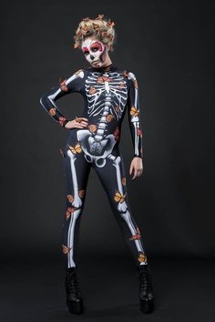 a woman in skeleton costume posing for the camera