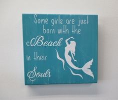 a wooden sign that says some girls are just born with the beach in their souls