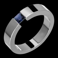 This is a 6.5mm  titanium & sapphire tension set ring. It is hand made on a machine. The ring is set with a 6mm genuine princess cut sapphire. Each ring is made to the customers specifications, meaning the customer can customize the following: -Ring size-Ring width (certain restrictions apply)-Stone size (certain restrictions apply)-Stone type (certain restrictions apply)-Metal color (black or regular titanium) -Metal type (certain restrictions apply)-Metal finish (polished, matte, sandblast Saphir Ring, Titanium Metal, Tension Setting, Premier Designs Jewelry, Set Ring, Platinum Ring, Jewelry Manufacturers, Mens Wedding Bands, Princess Cut