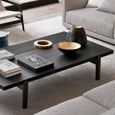 a living room filled with furniture and a coffee table