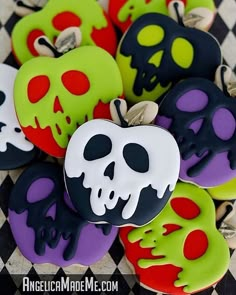 there are many decorated cookies with different designs on the top one has a skull in it