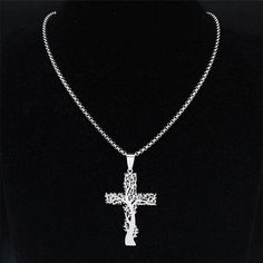 The nature cross necklace or tree crucifix pendant is made of solid hypoallergenic stainless steel. The nature cross pendant has a high polish finish and approximately measures 40mm long x 28mm wide x 1.4mm thick. The bail can accommodate a chain or cord up to 3.5mm wide. This nature cross pendant will arrive ready to wear on a 20-inch stainless steel round box chain necklace. Free shipping and a gift box are included with your purchase. SKU: FFJ-SSP-483 Aesthetic Necklace, Cross Jewelry Necklace, Women Aesthetic, Stainless Steel Chain Necklace, Pendant Necklace Silver, Round Box, Mens Pendant, Cross Jewelry, Cross Pendant Necklace