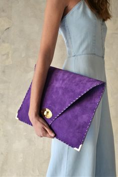 "Soft Symmetria Clutch in purple. The perfect bag for all occasions! Ideal for cocktail and parties or for business meetings depending the size you choose. It comes in two sizes, small and large. You can use it as a chic briefcase for your work or as a modern large clutch for a night out. This adorable large clutch is handmade out of a genuine, lux Italian purple suede leather. -Small size fits all your essentials, wallet, keys, mobile, cosmetics etc. -Large size fits a 15\" laptop, ipad, portof Purple Laptop, Handmade Leather Clutch, Leather Envelope Clutch, Purse Purple, Purple Clutch, Blue Leather Bag, Leather Clutch Purse, Italian Bags, Leather Envelope