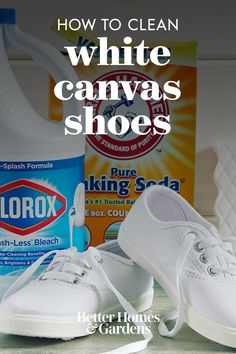 a pair of white shoes sitting on top of a table next to a bottle of cleaner