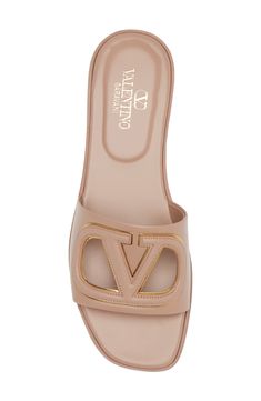 The Milan-based label's iconic VLOGO traced in metallic stands out further with crisp cutouts on a relaxed slide sandal fashioned in Italy from smooth leather. Leather upper, lining and sole Made in Italy Designer Shoes Hermes Sandal, Valentino Slides, Christian Louboutin Flats, Valentino Sandals, Designer Slides, Money Outfit, Women Slides, Designer Flats, Fall Inspo