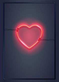 a heart shaped neon sign hanging from a wire