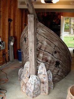 a boat made out of wood in a garage