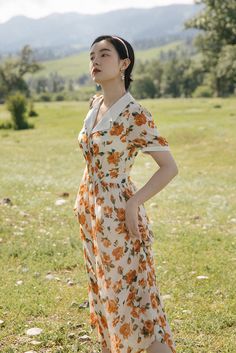 Emanate chic vintage vibes in this bold warm orange rose printed dress with short puff sleeves, notched collar, flower buttons and waist tie. S: 33" chest, 26.5" waist, 45" lengthM: 34.5" chest, 28" waist, 45" lengthL: 36" chest, 29.5" waist, 45" lengthXL: 37.5" chest, 31" waist, 45" length Orange Short Sleeve Dress For Daywear, Vintage Prairie Dress, Sunset Rose, Floral Dress Formal, Midi Dress White, Rose Print Dress, Spring Maxi Dress, Cottagecore Dress, Summer Wedding Dress