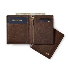 Crafted from the same rich pebbled leather as the rest of our best selling Harvey collection, this travel wallet makes a great gift for the for the jetsetter. The taller profile is designed to fit both a passport and various sizes of paper currency, with a secure zipper pocket for coins and slots for multiple cards. Make a memorable gift by adding a sophisticated monogram.    4.75"w x 5.75"h x 0.5"d  Pebbled leather with antiqued brass hardware.  Imported.  Monogramming is foil debossed. Luxury Leather Wallets For Personal Use, Best Slim Wallet, Business Card Wallet, Bifold Wallet Men, Leather Travel Wallet, Unique Wallets, Minimalist Leather Wallet, Front Pocket Wallet, Mens Wallet