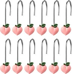 twelve strawberry shaped hooks with green leaves on each hook and two pairs of hooks attached to them