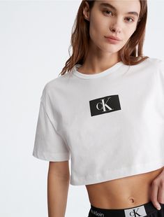 Amplified classics, Calvin Klein 1996 is a vibrant logo story featuring our iconic monogram framed in a box. A new approach to print and color with a distinct graphic language. This t-shirt is crafted completely from organic cotton for extra soft comfort and reduced environmental impact.  Material: 100% Organic Cotton. Calvin Klein Outfits Woman, Calvin Klein Crop Top, Calvin Klein Tshirt, Calvin Klein Outfits, Ck Calvin Klein, Calvin Klein Women, Crop Top Shirts, Cropped T Shirt, Womens Loungewear